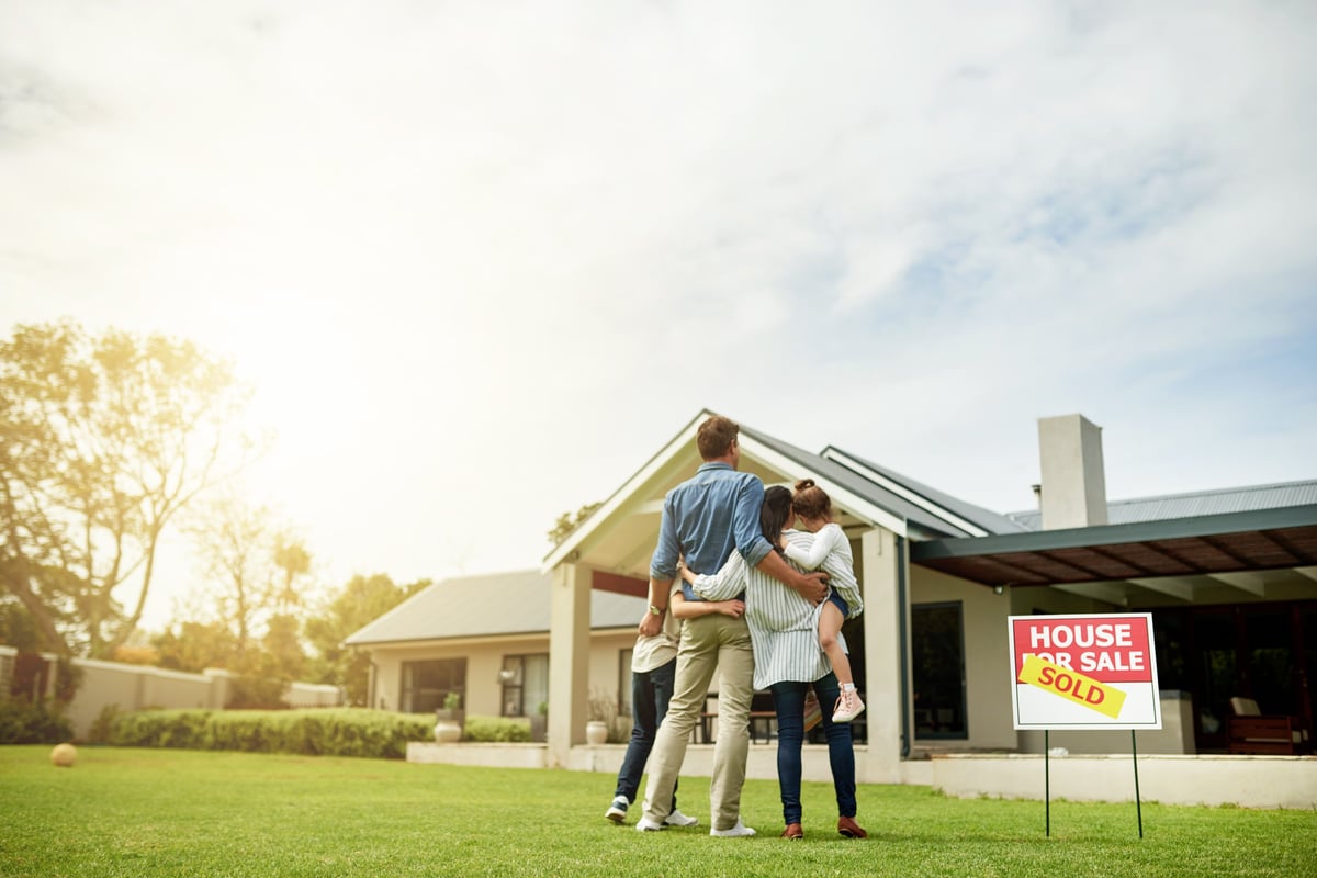 Family viewing their new home after qualifying for a mortgage again