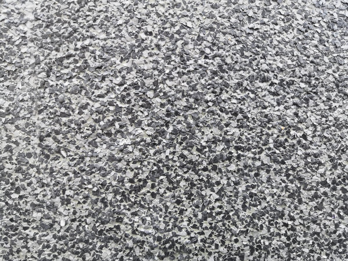 Full-flake broadcast epoxy floor — dense decorative color flakes for complete coverage showroom-quality finish