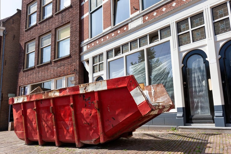 Red skip for dumping renovation waste on a street