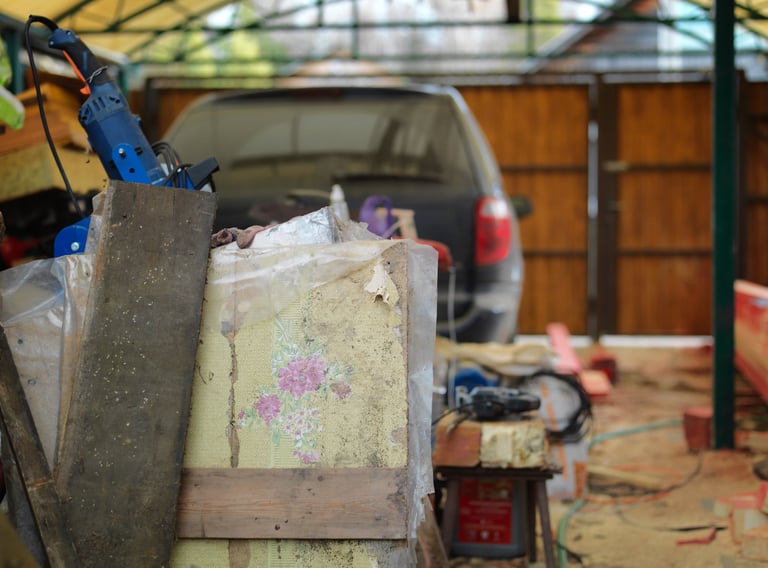 Garage refurbishment with unwanted items in foreground