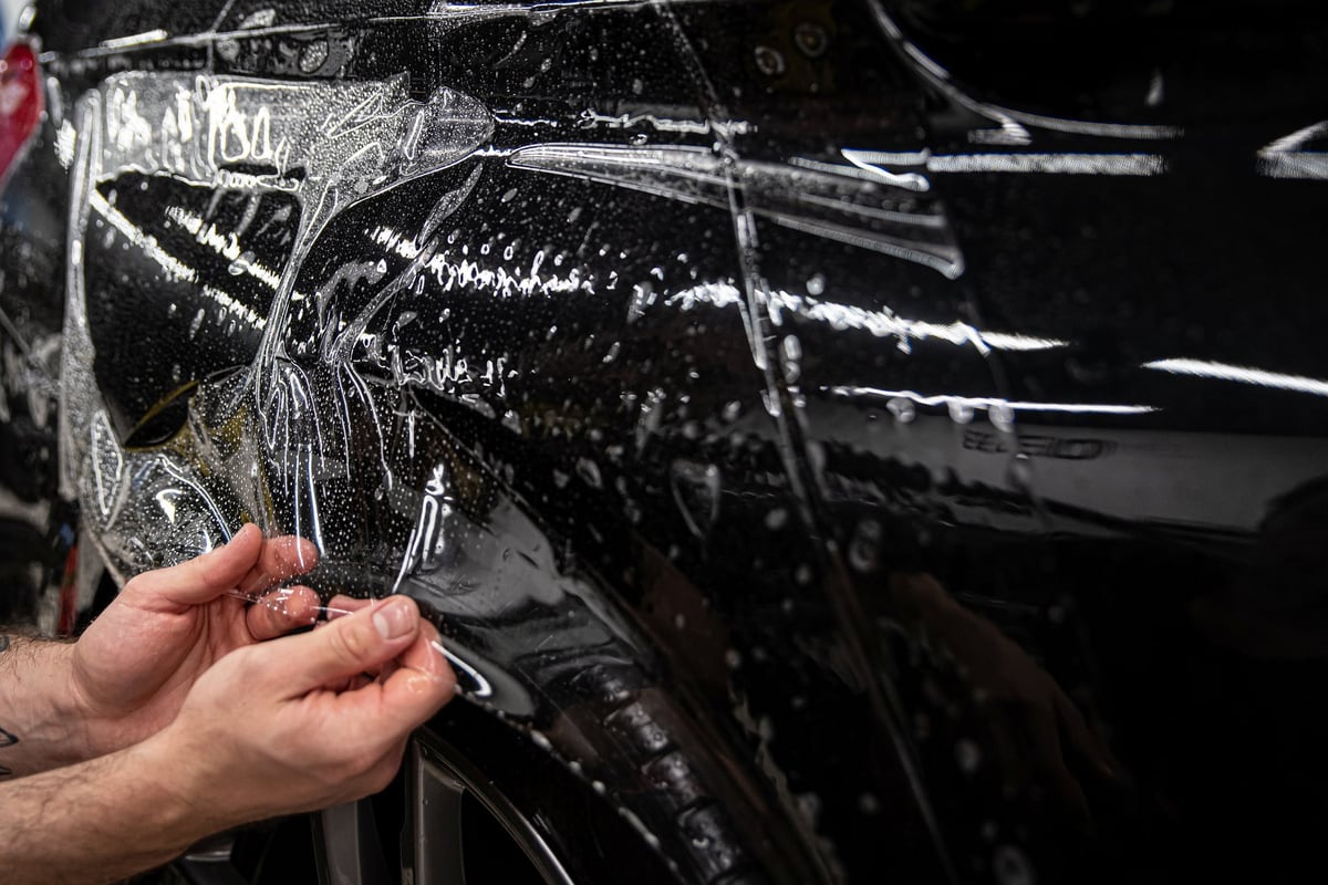 Professional PPF application on car body panel at Arko Detailing studio N4 Gateway