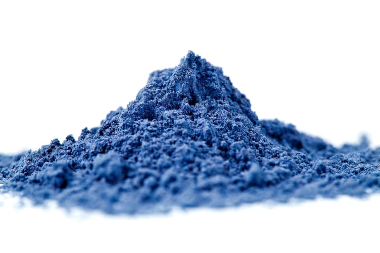 Blue nila powder on white background