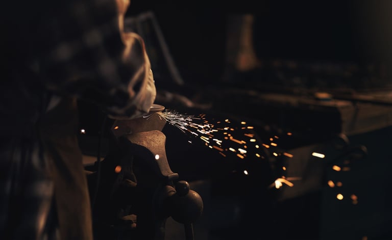 Metal finishing and grinding with angle grinder at foundry