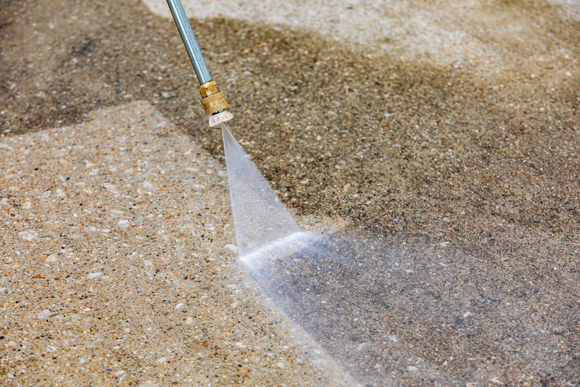 High pressure water spray cleaning concrete surface