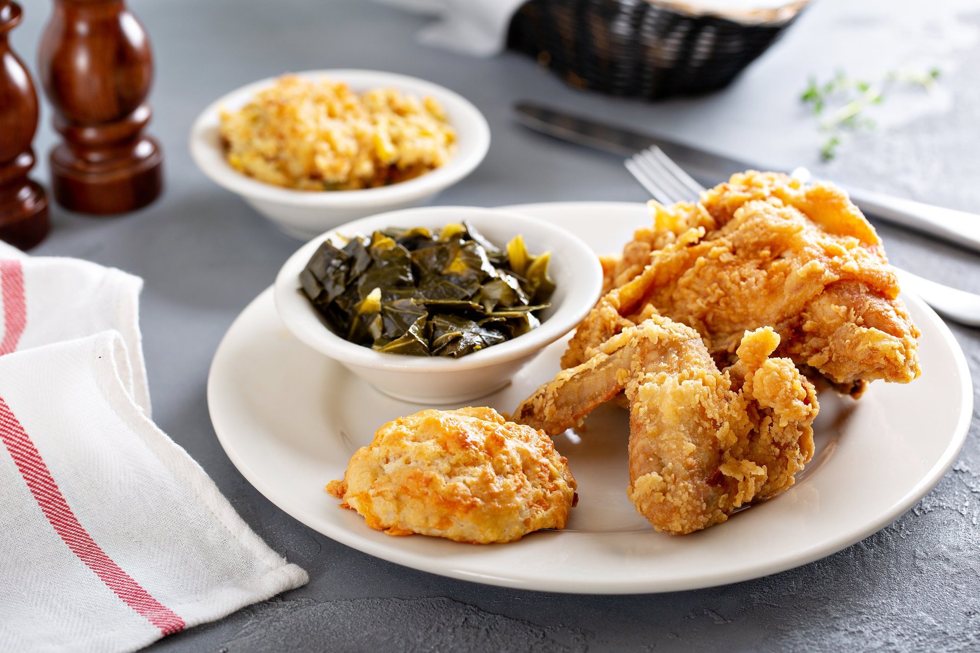 Southern fried chicken with collard greens, mac and cheese and biscuit