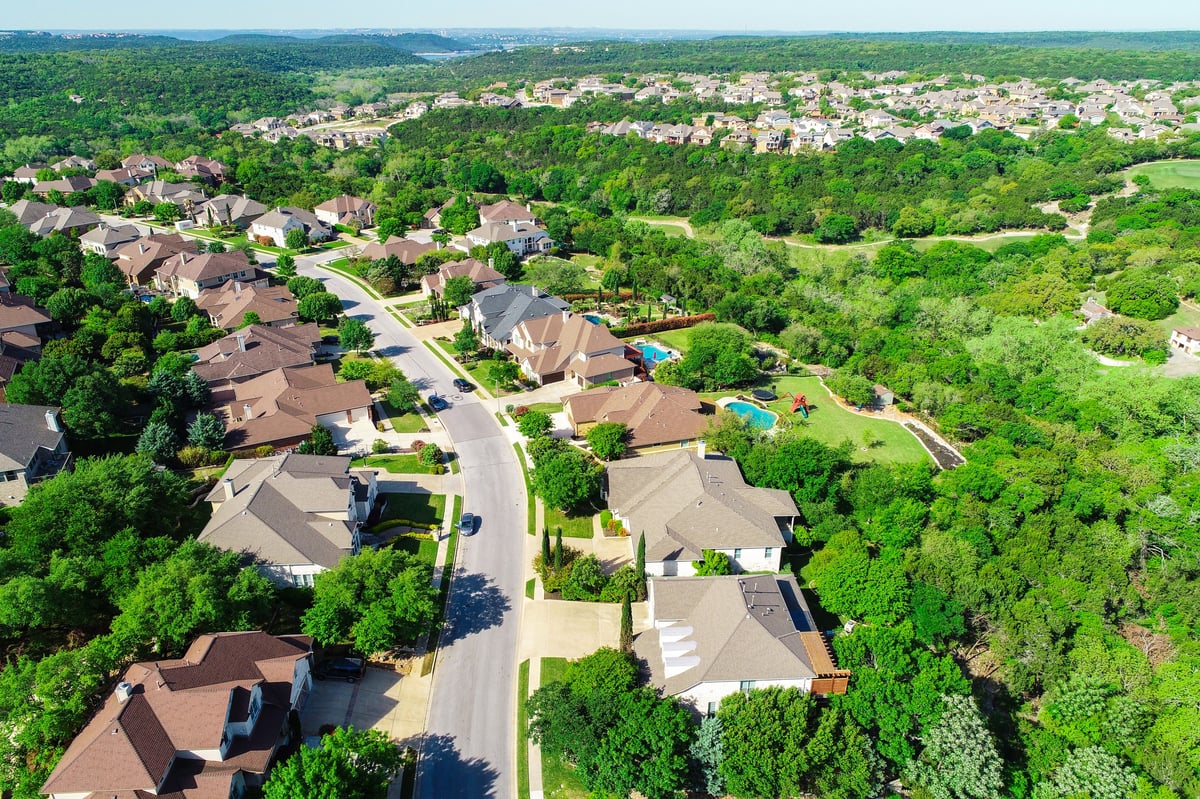 Aerial view of suburban homes alongside investment properties