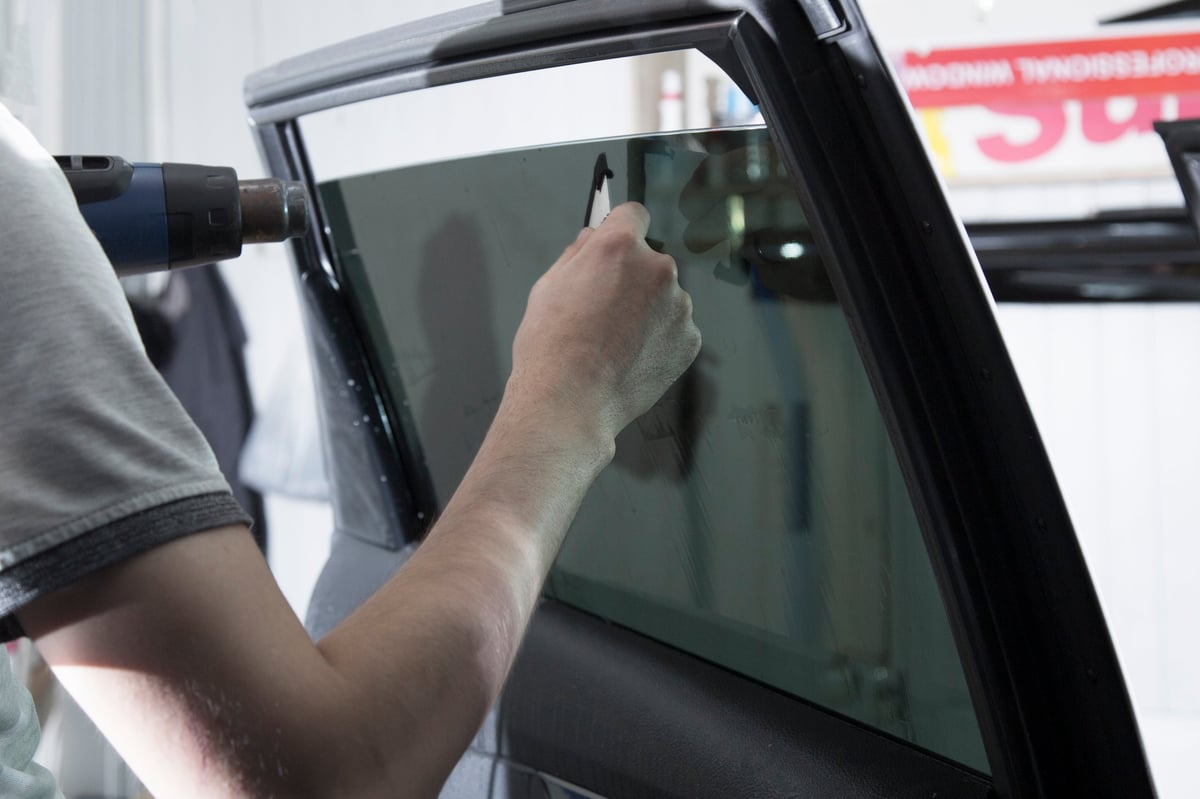 Premium window tinting film installation on car windows Arko Detailing