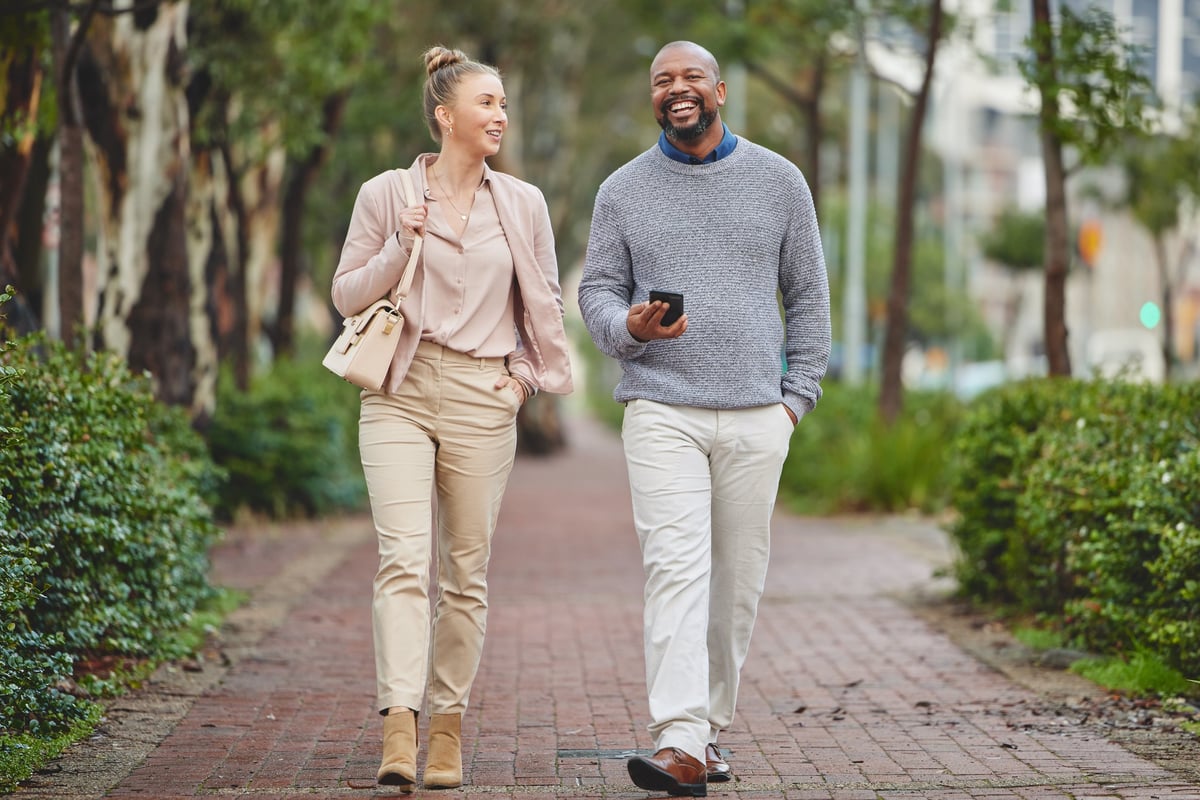 An independent adult walking to work outdoors in a residential community