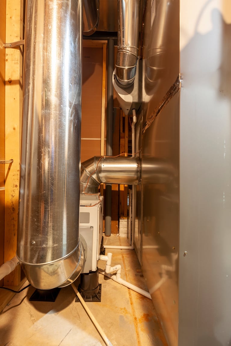 Whole-home dehumidifier attached to HVAC furnace system — removes moisture from circulating air for total home comfort