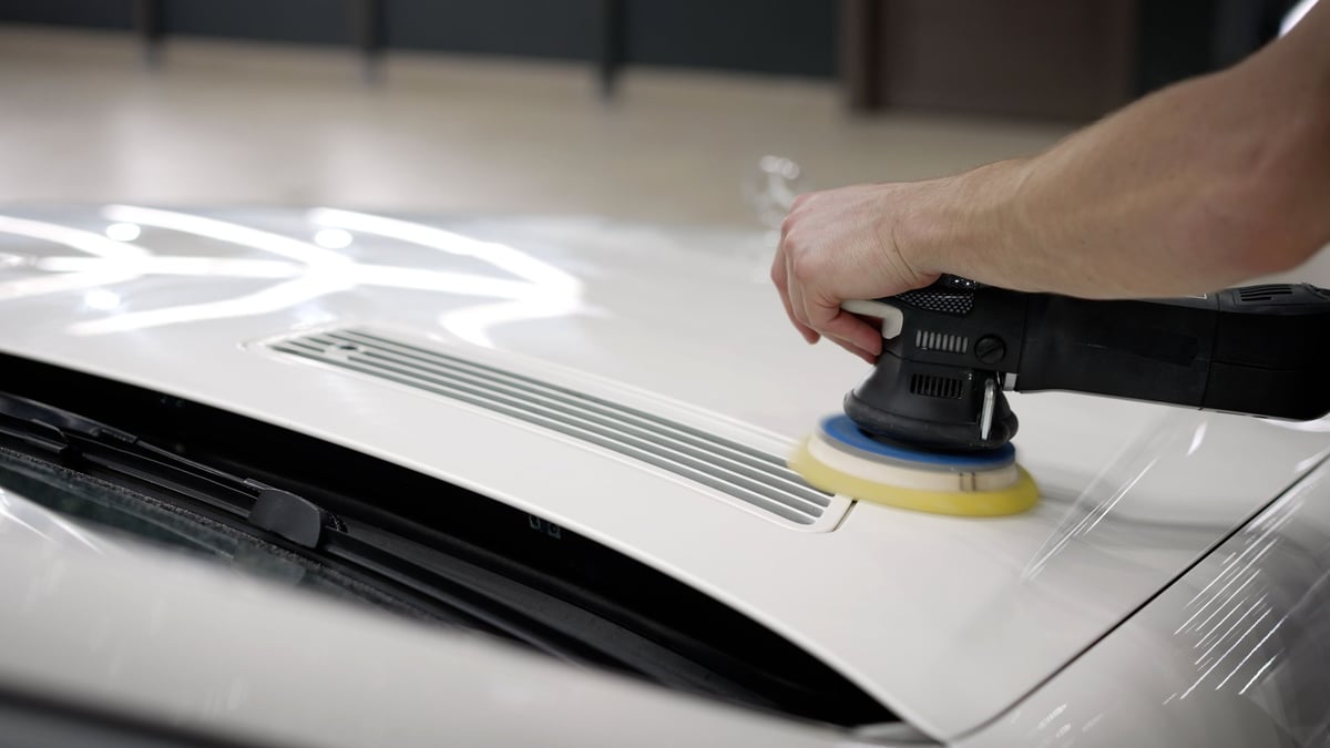 Machine polishing and paint correction on white car panel at Arko Detailing studio