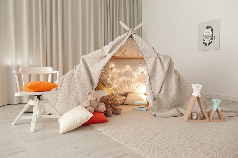 Cozy play tent with fairy lights in a modern child's room — neutral and inviting sleepover styling