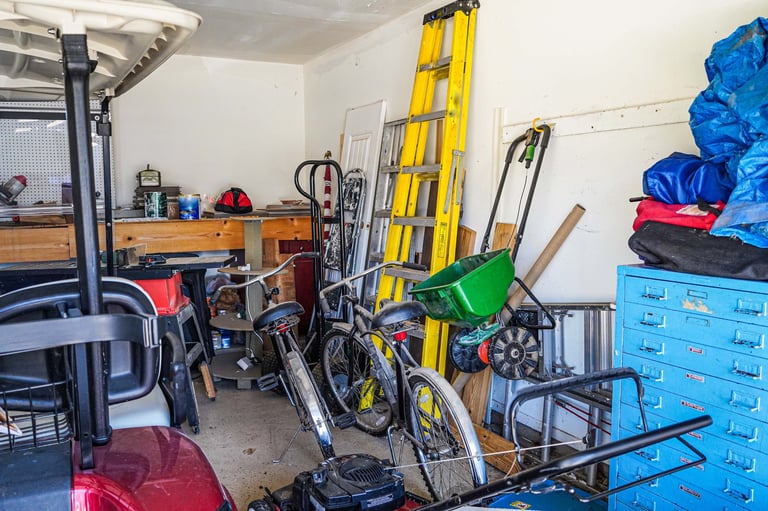 An over-crowded unorganized garage before cleanout
