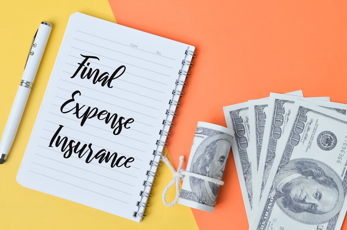 Final Expense Insurance concept with money and notebook