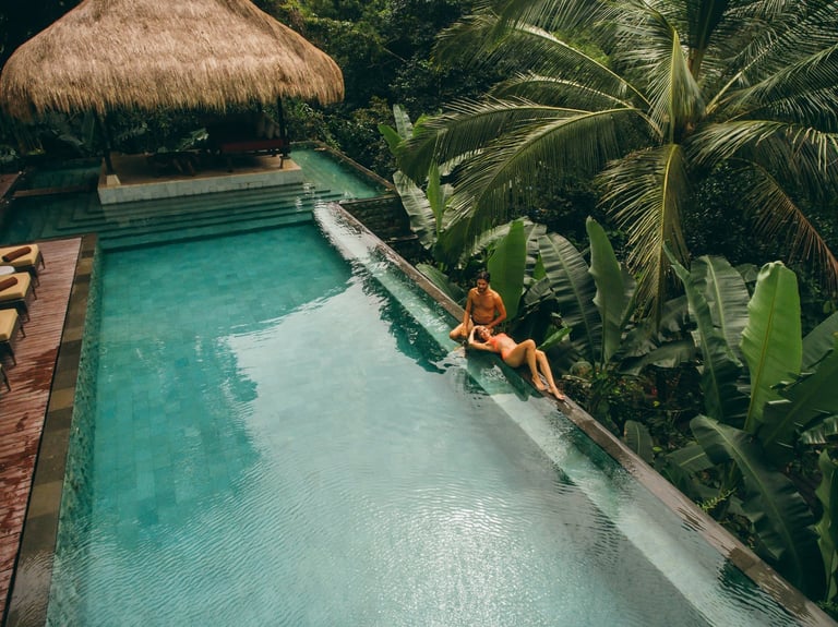Couple relaxing at a luxury Cancún resort pool