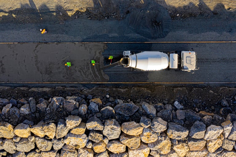Concrete pouring with mixer truck on construction site