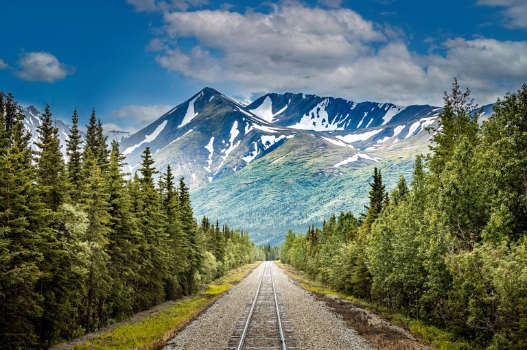 Scenic Alaska railroad to Denali National Park with dramatic mountains