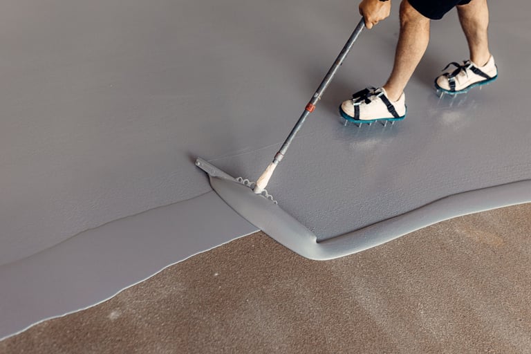 Worker applying concrete coating
