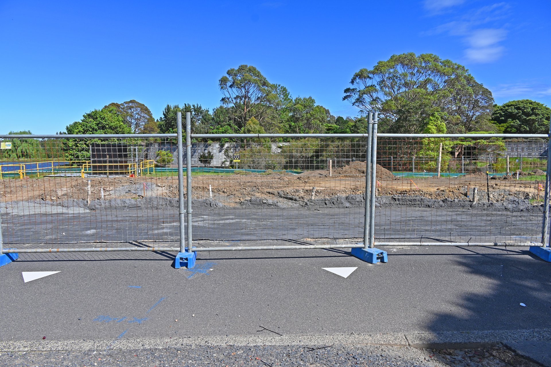 Temporary fence panels forming a boundary around a construction site