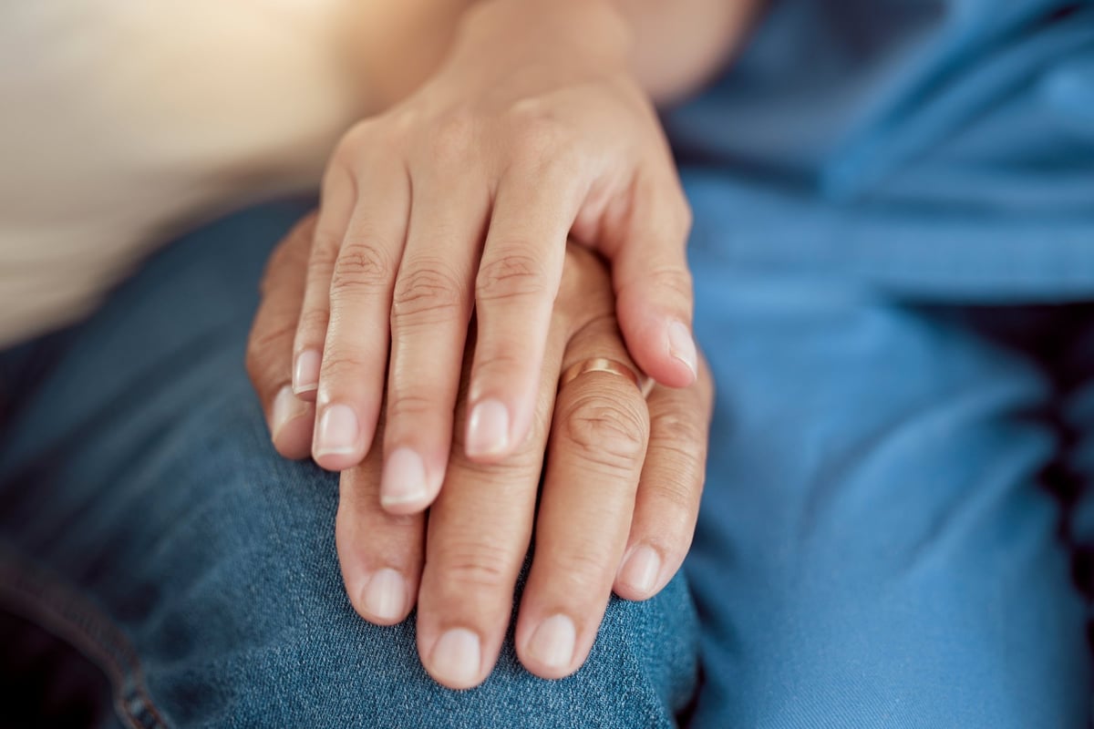 Support and trust with holding hands of elderly woman