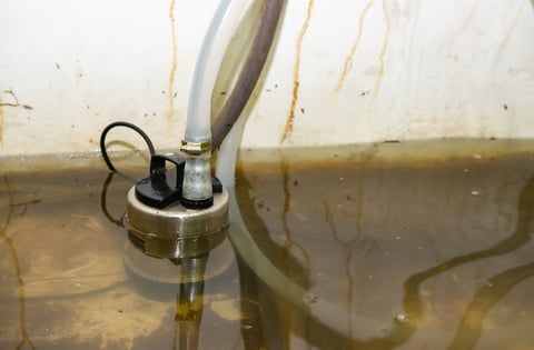 Water pump extracting flood water from home