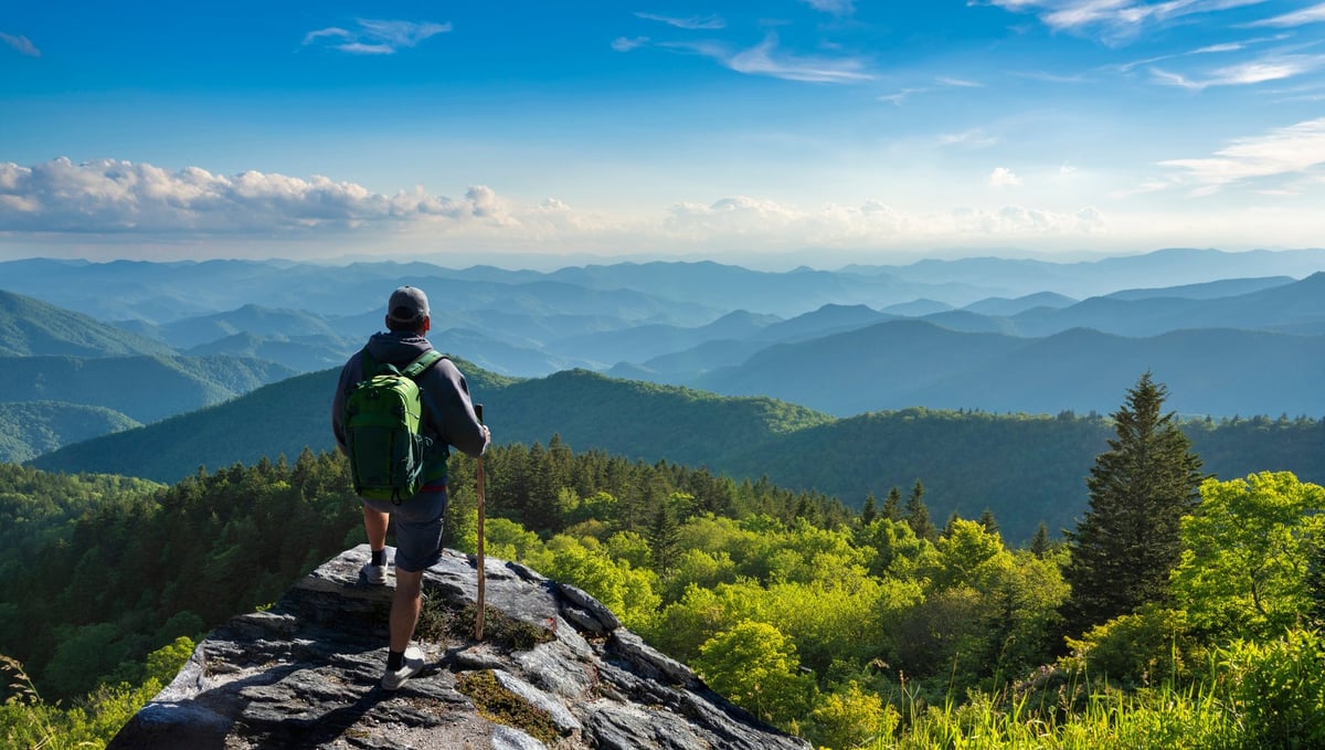 Veteran enjoying panoramic mountain view after a hike