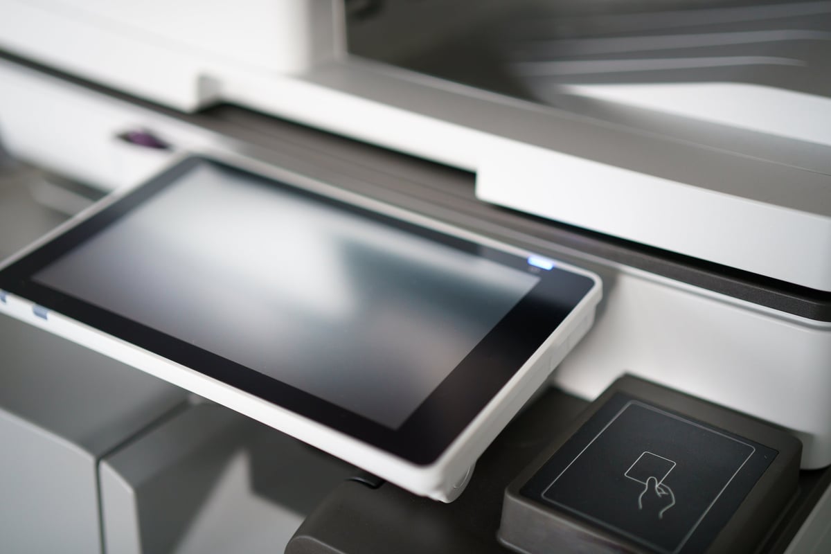 Secure release printing using an access card reader on an office device to protect confidential documents