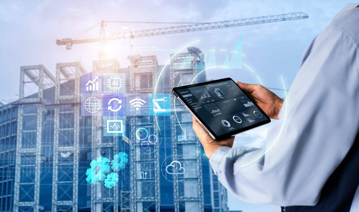 Hands using a digital tablet with building management software on site