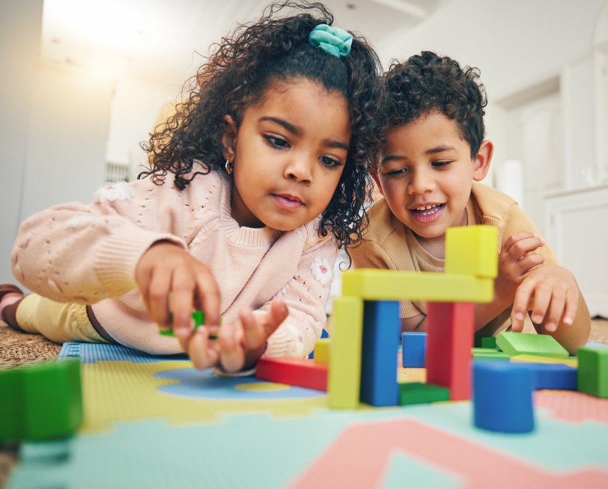 Children working together with building blocks during a hands-on classroom activity