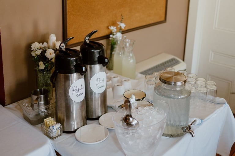 Warm coffee and cups setup at an elegant wedding rehearsal