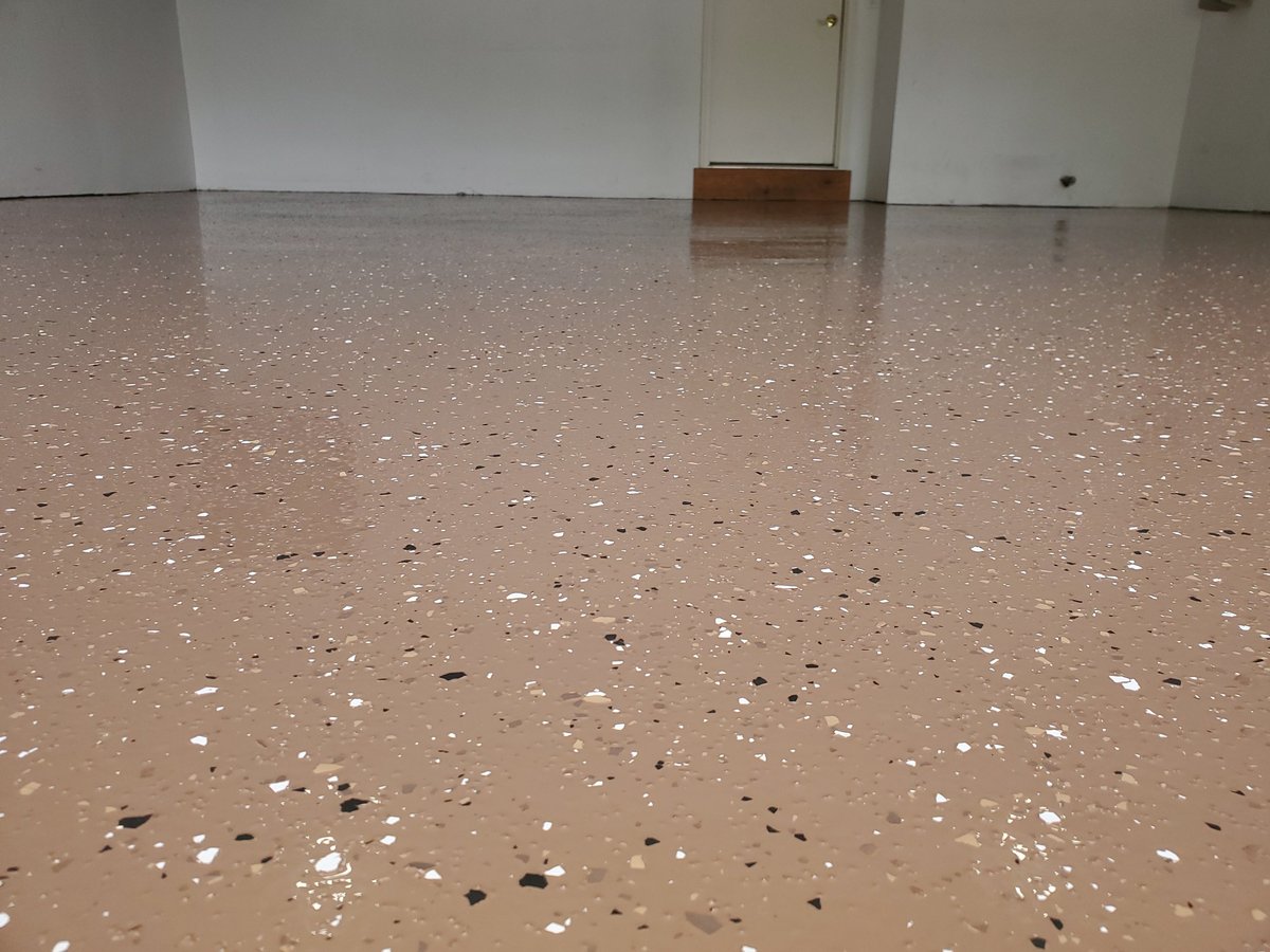 Premium epoxy floor coating in residential garage with glossy finish