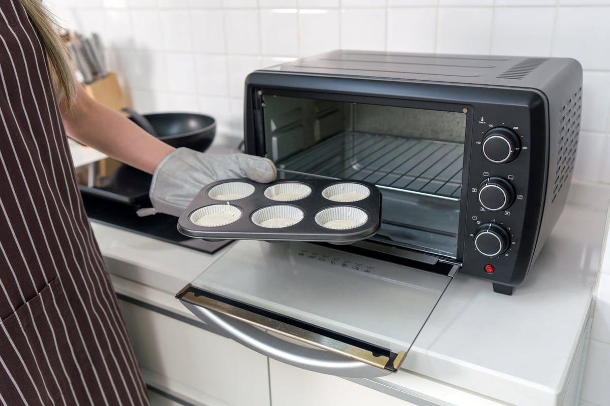 Fresh muffins going into the VORA oven — everyday baking made effortless