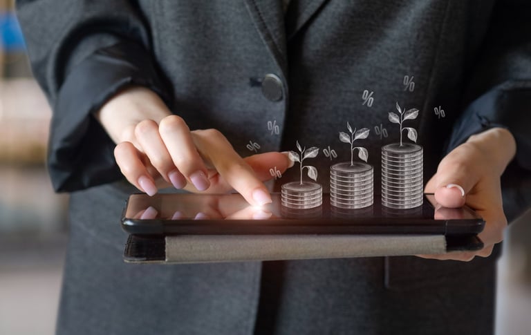 Businesswoman with tablet and growing investments