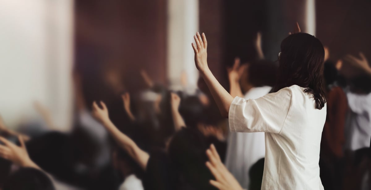 Passionate worshippers with hands raised in prayer