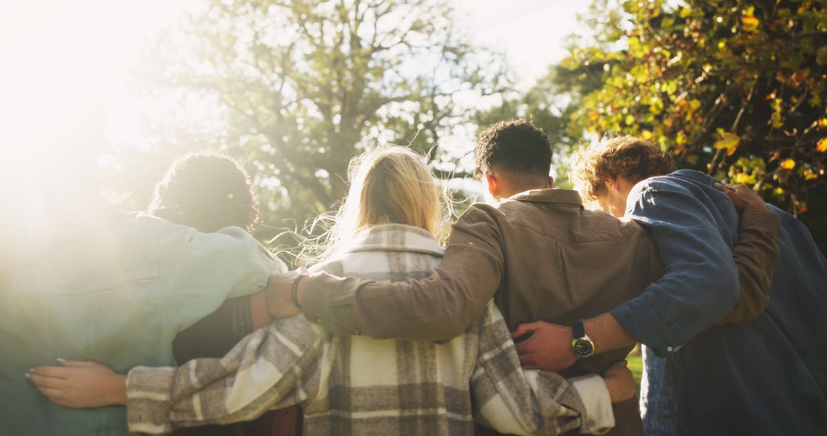 Youth group relaxing together outdoors