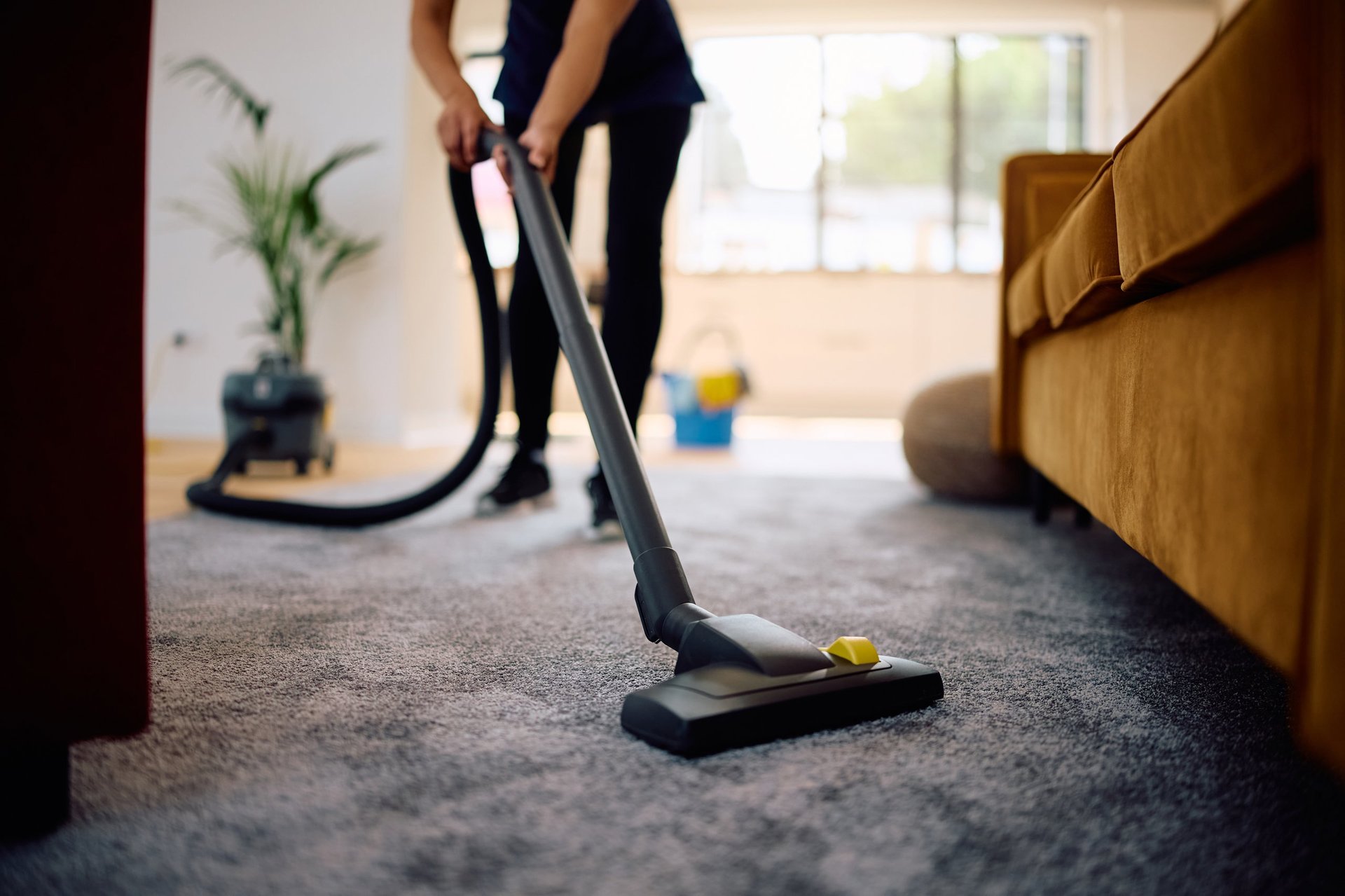 Professional cleaner wiping a surface thoroughly during a detailed deep cleaning of a home