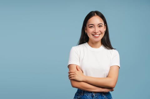 Smiling asian woman posing with crossed arms