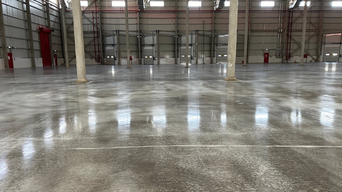 Modern polished concrete industrial facility with dramatic lighting