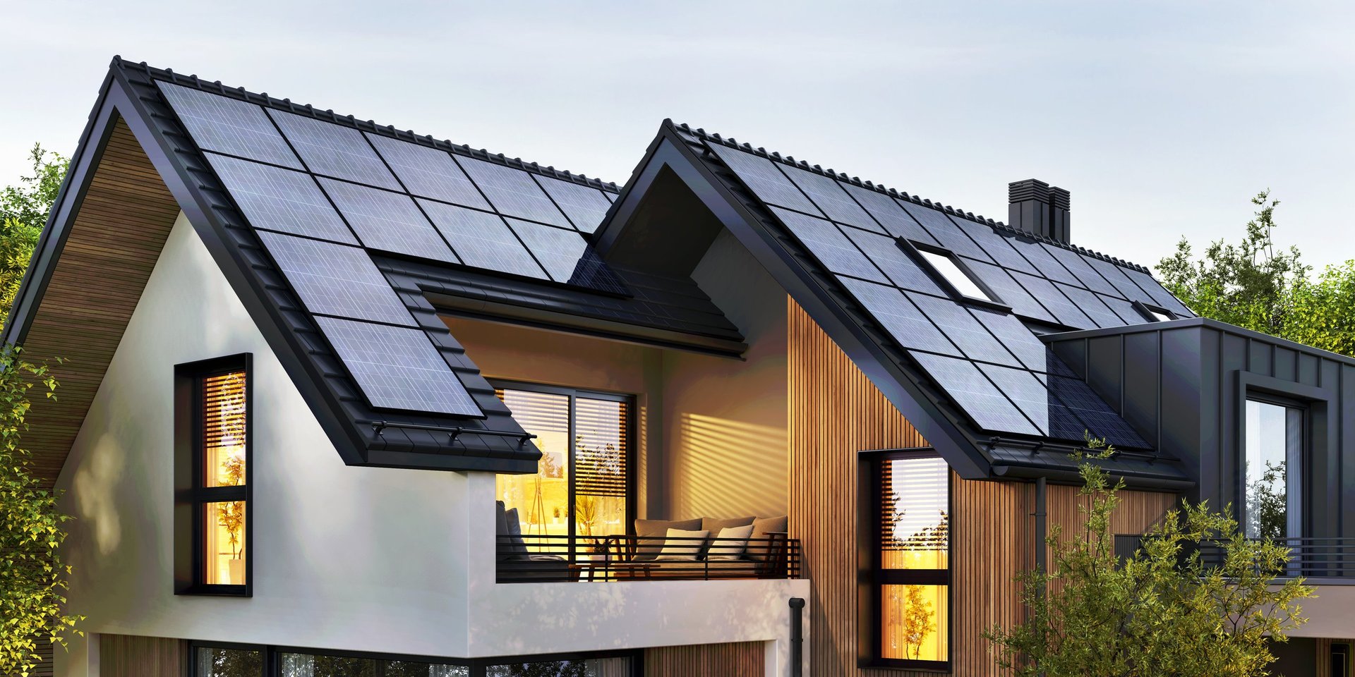 Solar panels on the roof of a modern house under bright blue sky