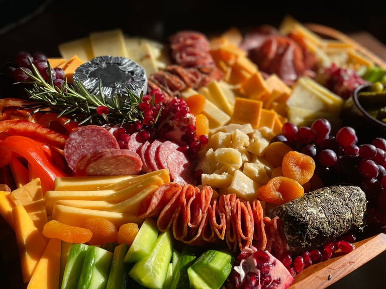 Close up cheese board charcuterie antipasto with cured meats and artisan cheeses