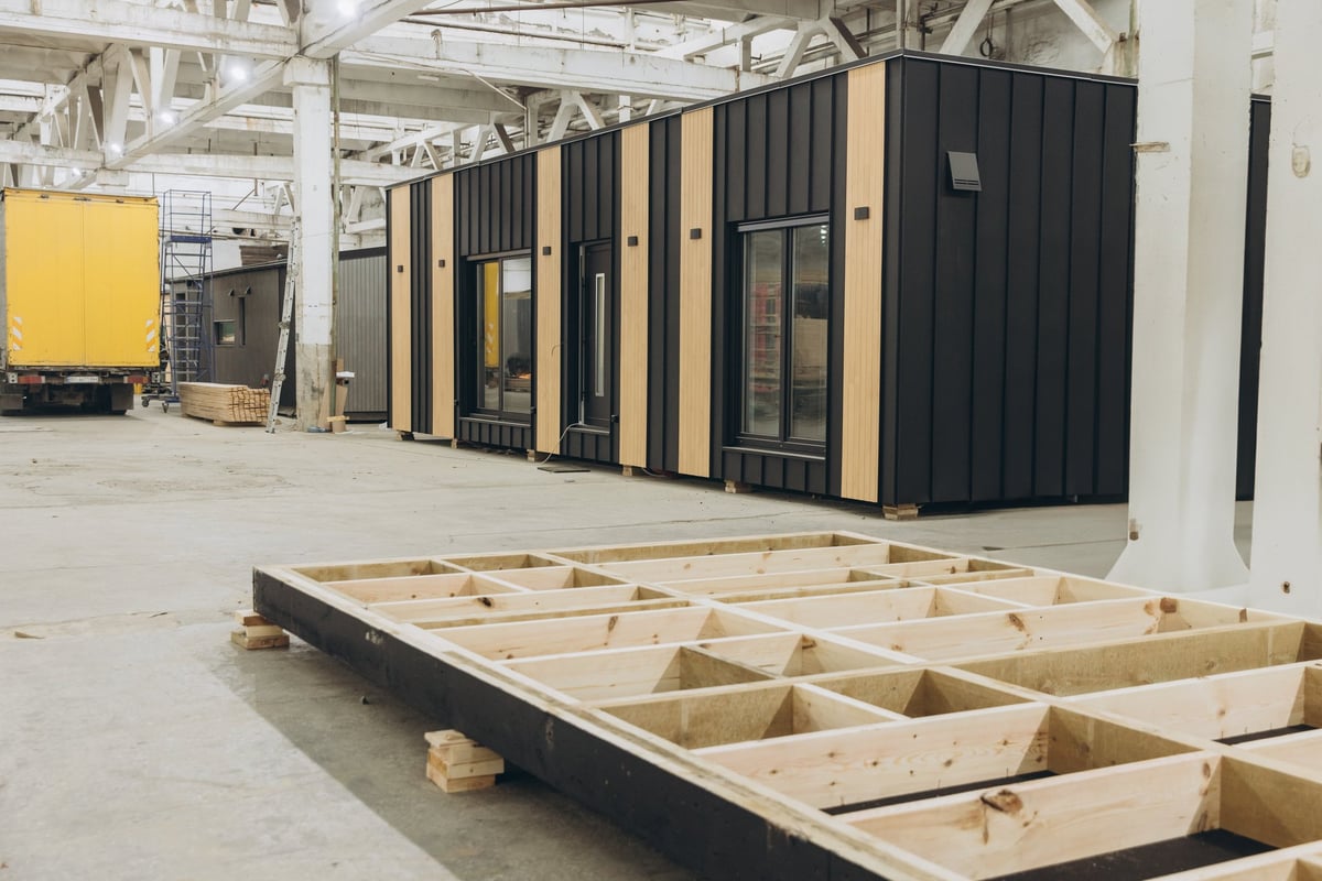 A modular unit being prepared and worked on in a factory