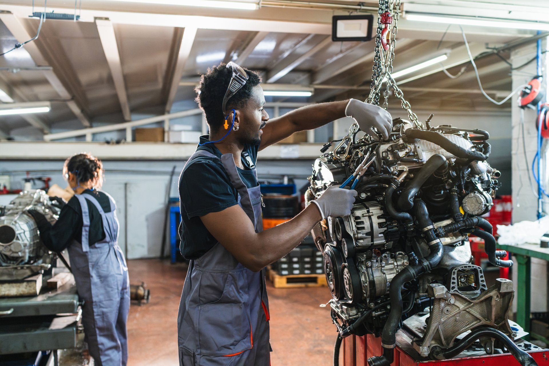 Lighthouse Milton students working together on an automotive project