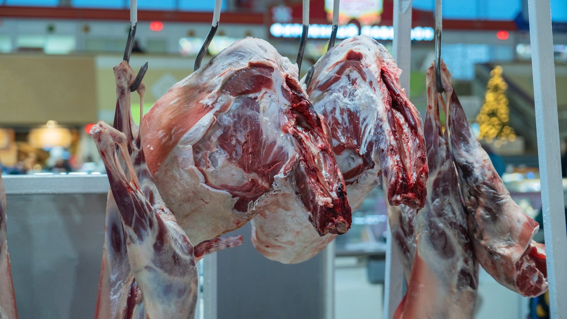 Fresh meat cuts and carcasses at market
