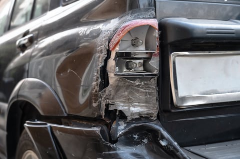 Rear bumper and taillight collision damage Newark NJ