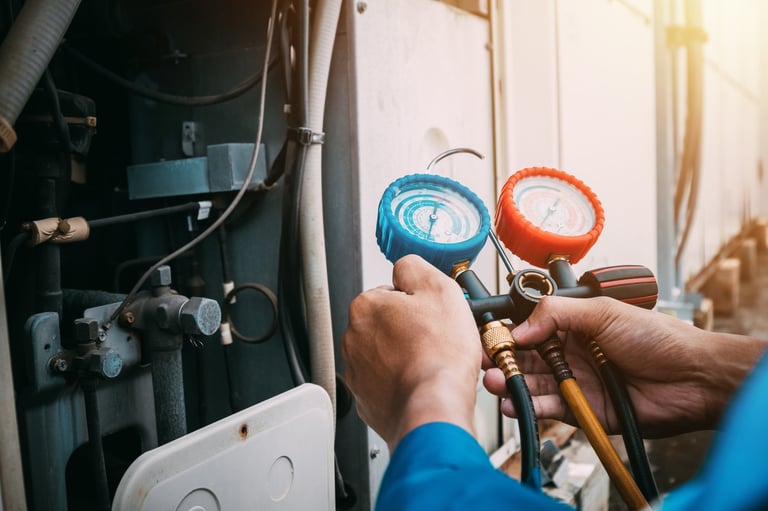 HVAC technician checking AC refrigerant leak