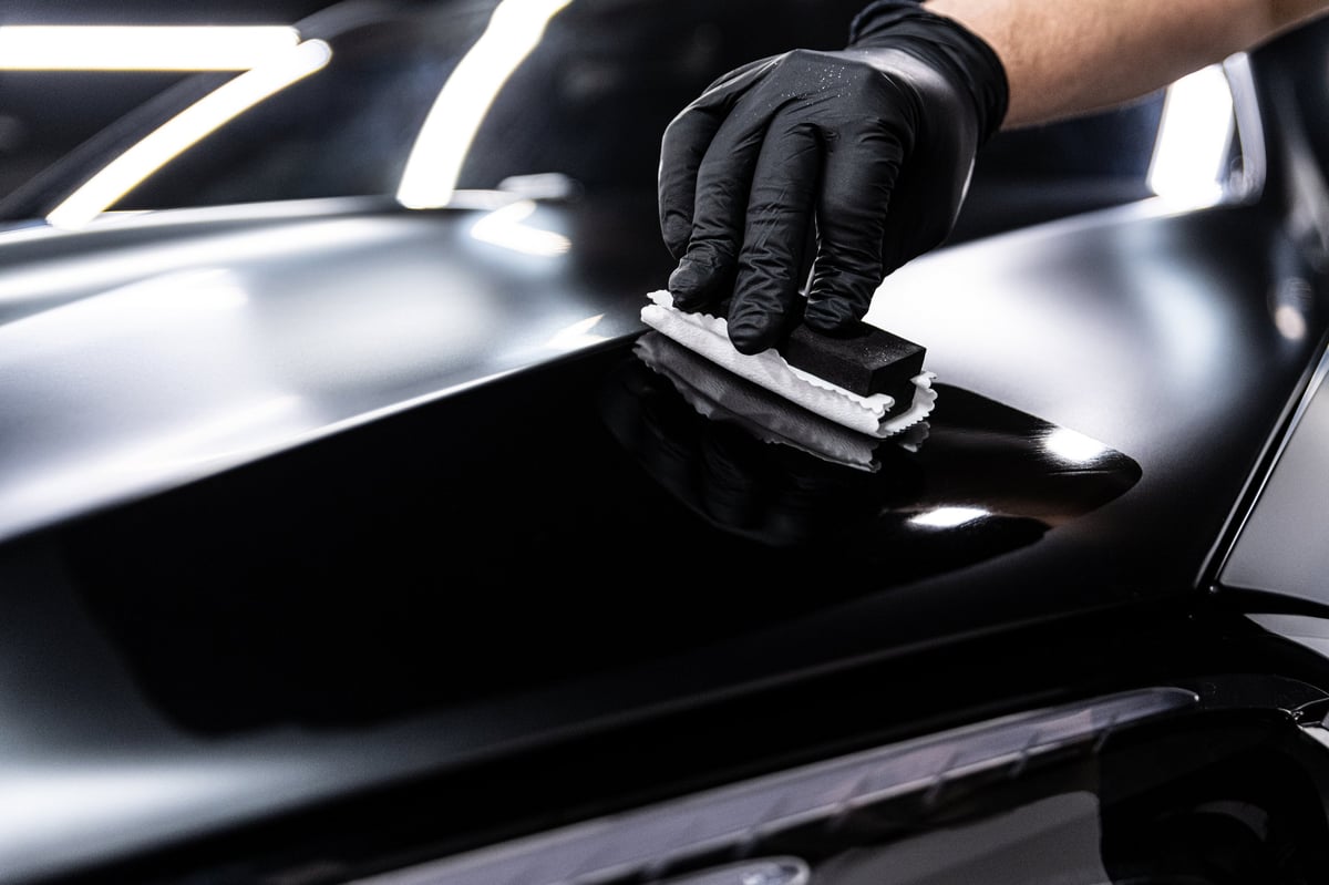 Arko Detailing applying ceramic coating to black car paint for deep gloss finish Pretoria East