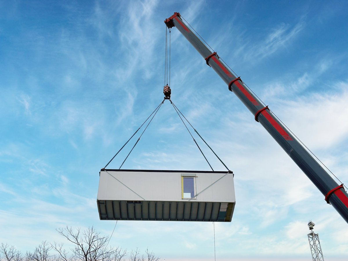 Modular unit being positioned on a construction site