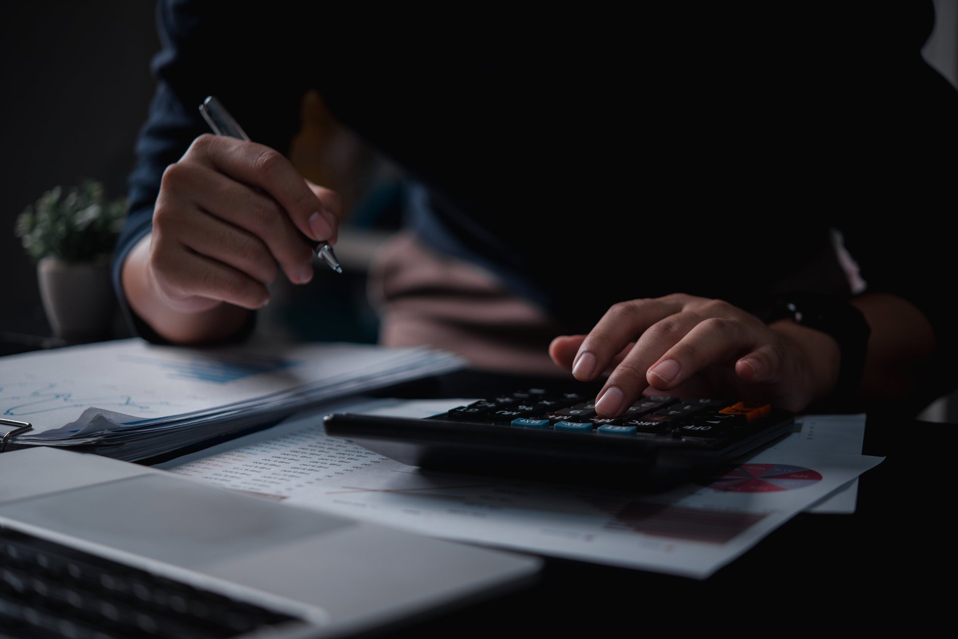 Business financial documents and tax planning on desk
