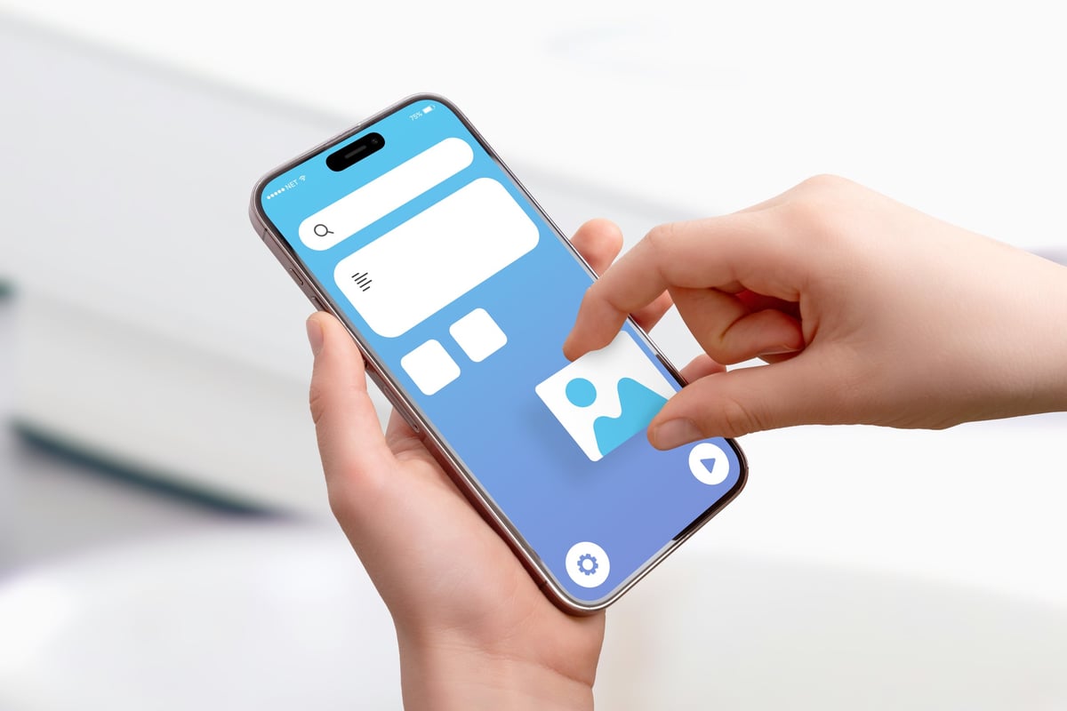 A smartphone displaying a clean, modern mobile website interface against a neutral background, representing mobile-first design principles