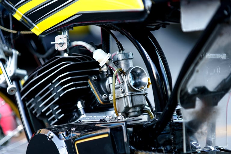 Motorcycle engine and carburettor detail — precision cleaning of mechanical components at Arko Detailing