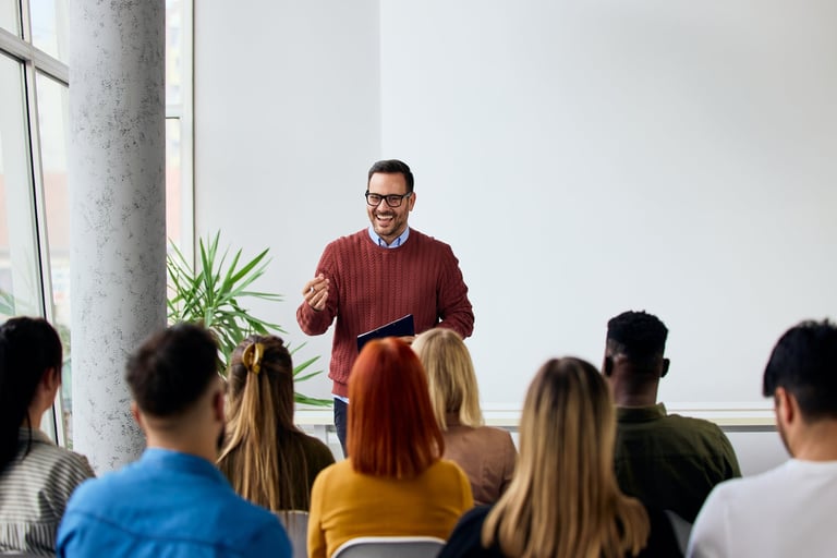 Black corporate speaker leading motivating training session for diverse professionals